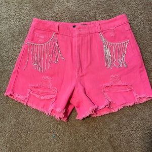 Hot pink fringe denim shorts